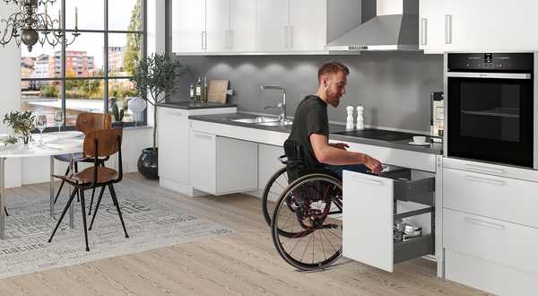 Interior design of a kitchen accessible to disabled people and people with reduced mobility.